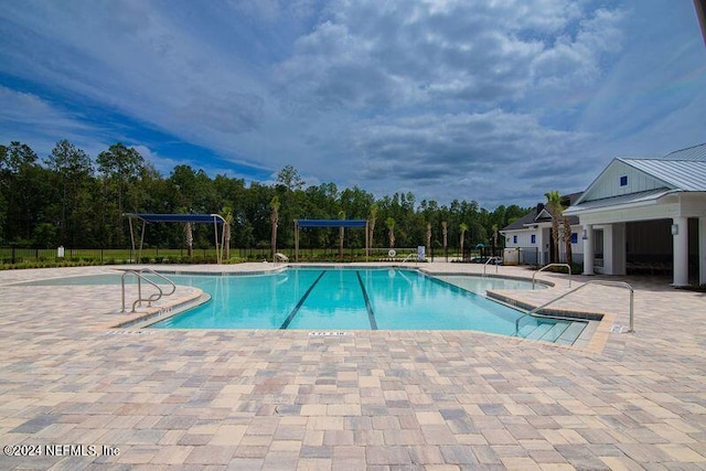 view of swimming pool with a patio area