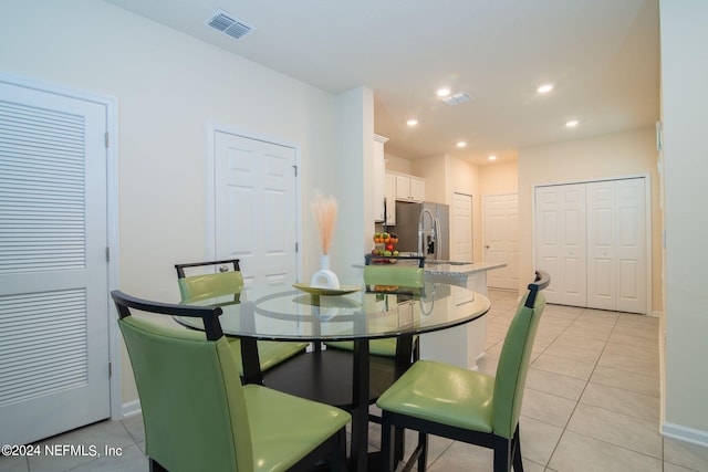 dining space with light tile patterned flooring