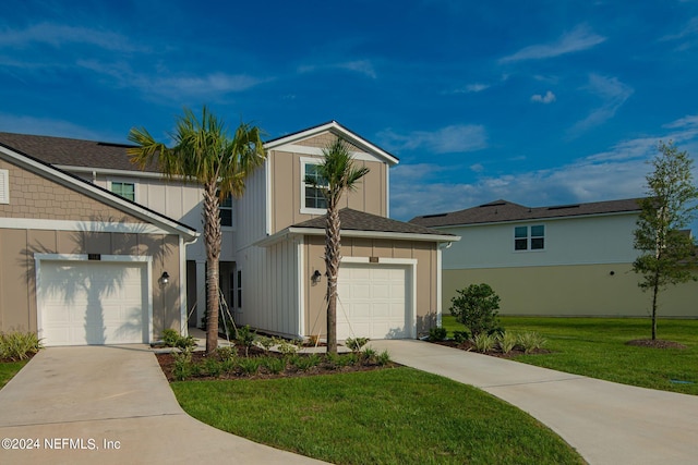 view of front of home with a garage and a front lawn