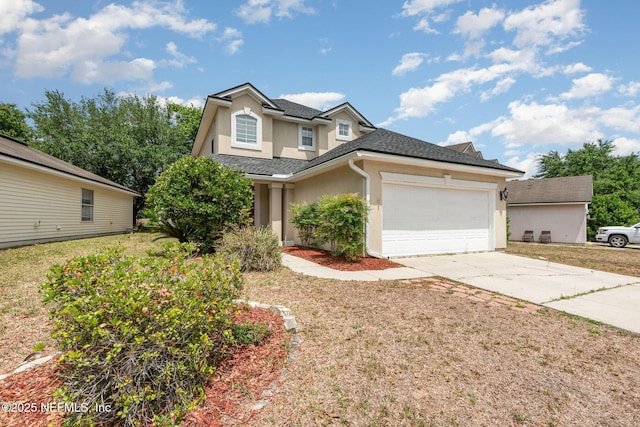 traditional-style home with concrete driveway, a garage, stucco siding, and roof with shingles