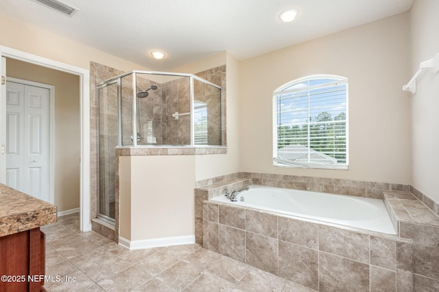 full bath featuring a garden tub, a stall shower, tile patterned flooring, and visible vents
