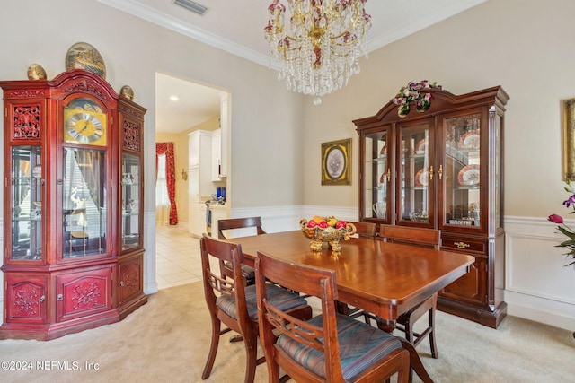 carpeted dining area with an inviting chandelier and crown molding