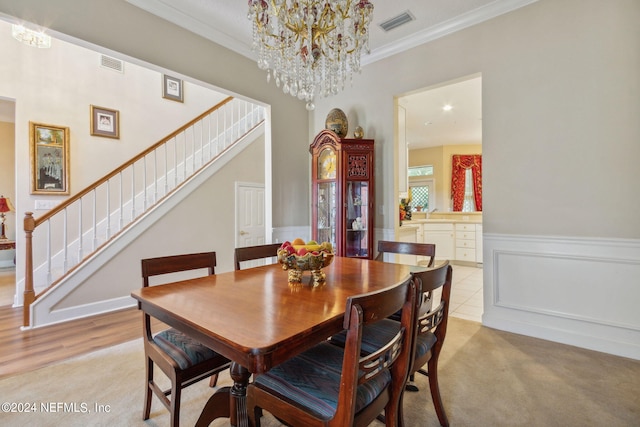 dining room featuring a notable chandelier and crown molding