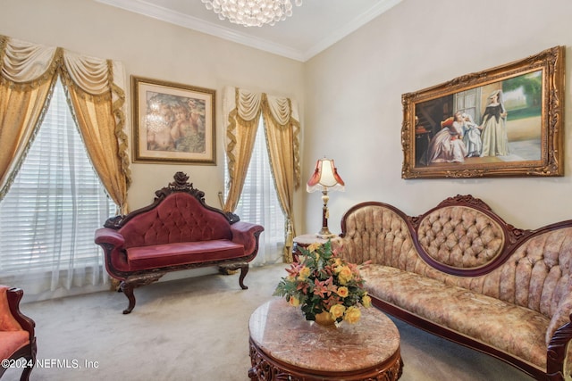 sitting room featuring ornamental molding, carpet flooring, and a notable chandelier