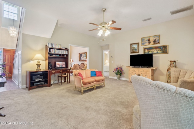 living room with ceiling fan and carpet