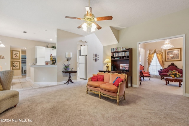 carpeted living room with ceiling fan and a textured ceiling