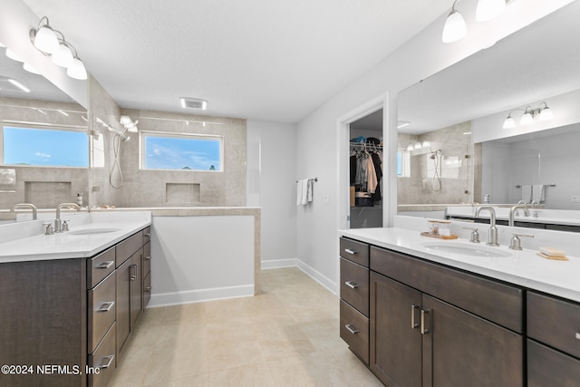 bathroom featuring dual vanity and tile patterned flooring