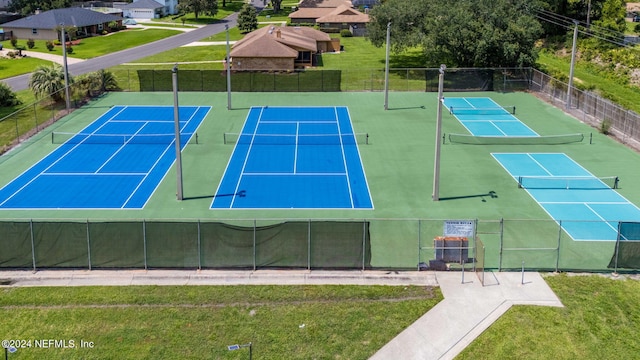 view of sport court with a yard and basketball court