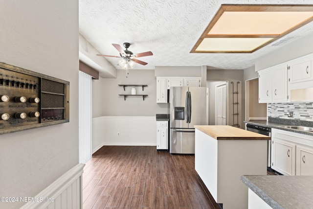 kitchen with dishwasher, a center island, white cabinets, dark hardwood / wood-style floors, and stainless steel fridge with ice dispenser