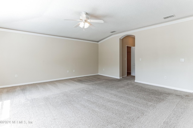 carpeted empty room featuring a textured ceiling, ornamental molding, and ceiling fan