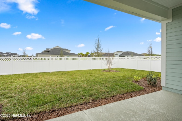 view of yard with a fenced backyard