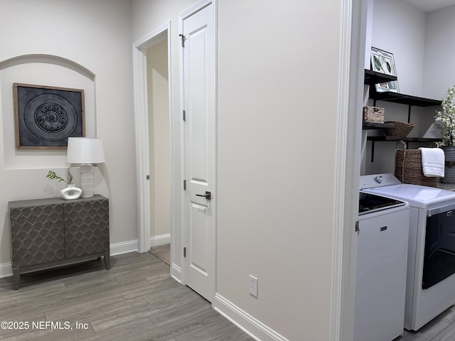 95014 Brookhill Pl, Fernandina Beach, FL 32034 - washroom with washer and clothes dryer and light wood-style floors