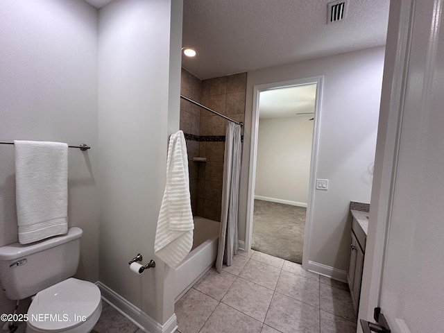95014 Brookhill Pl, Fernandina Beach, FL 32034 - full bathroom featuring vanity, shower / bath combo with shower curtain, tile patterned floors, and a textured ceiling