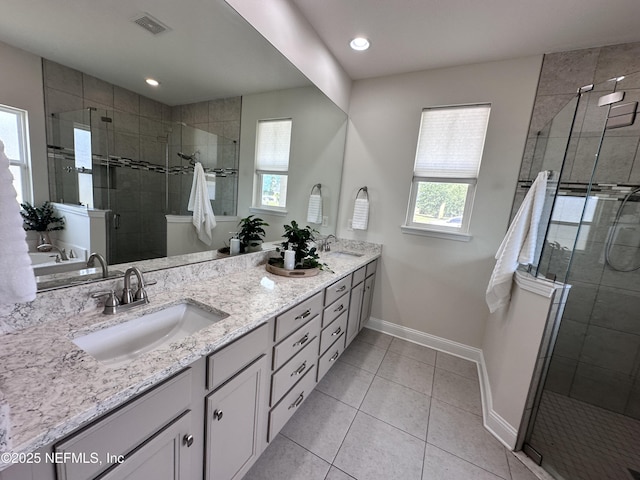 95014 Brookhill Pl, Fernandina Beach, FL 32034 - full bathroom featuring double vanity, a shower stall, tile patterned floors, and recessed lighting