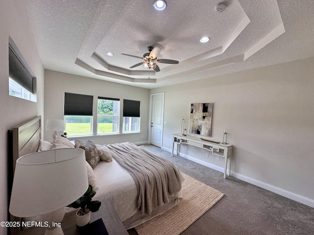 95014 Brookhill Pl, Fernandina Beach, FL 32034 - bedroom featuring a textured ceiling, carpet flooring, a raised ceiling, ceiling fan, and recessed lighting