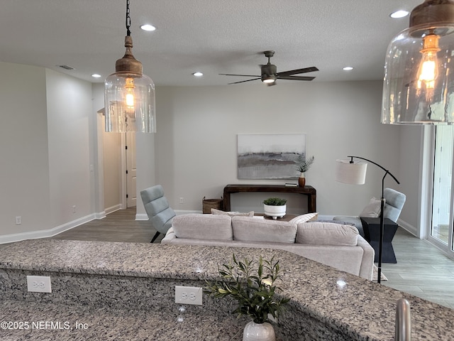 95014 Brookhill Pl, Fernandina Beach, FL 32034 - living room with recessed lighting, wood finished floors, ceiling fan, and a textured ceiling