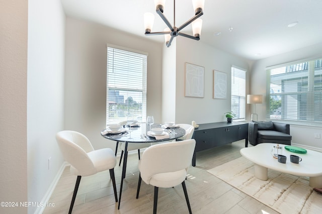 dining space with a notable chandelier