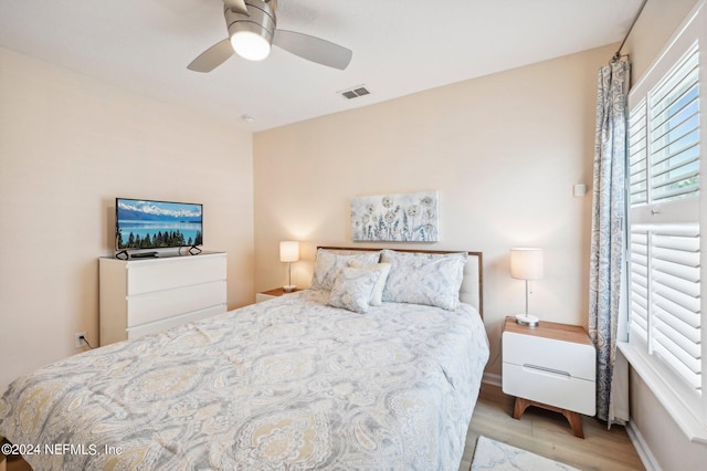 bedroom featuring ceiling fan and light hardwood / wood-style floors