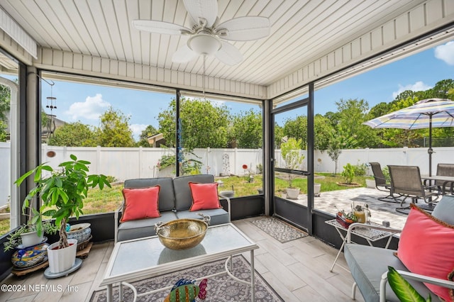 sunroom / solarium with ceiling fan