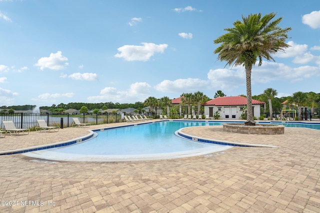 view of swimming pool with a patio