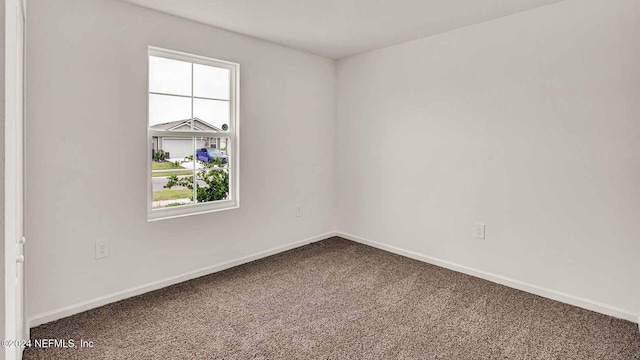 empty room featuring carpet flooring