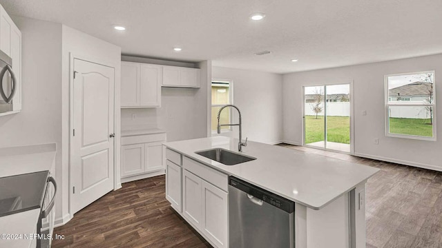 kitchen featuring sink, dark wood-type flooring, stainless steel dishwasher, a kitchen island with sink, and white cabinets