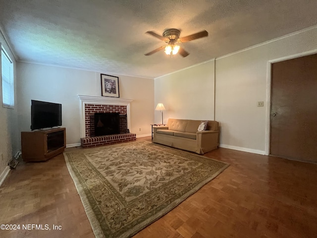 living room featuring a fireplace, a textured ceiling, ceiling fan, and parquet flooring