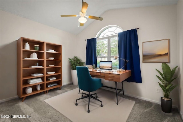 office area featuring ceiling fan, vaulted ceiling, and dark colored carpet