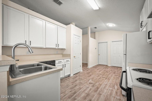 kitchen featuring white cabinetry, sink, a textured ceiling, lofted ceiling, and light wood-type flooring