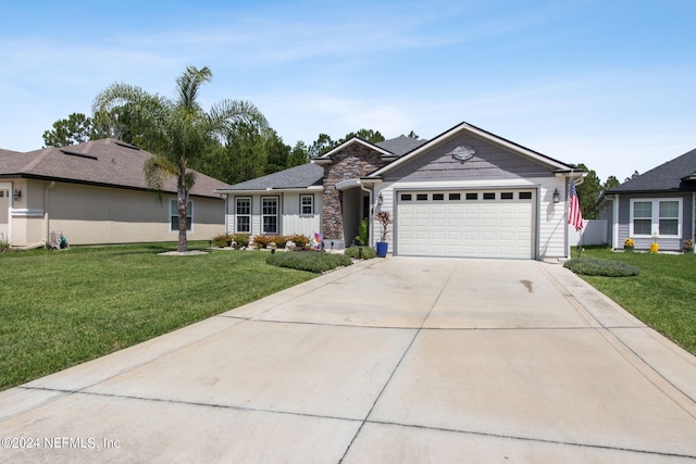 ranch-style home with a front yard and a garage