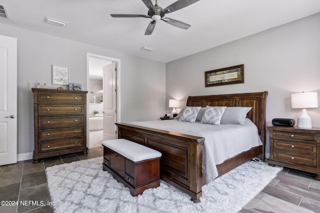 bedroom featuring ensuite bathroom and ceiling fan