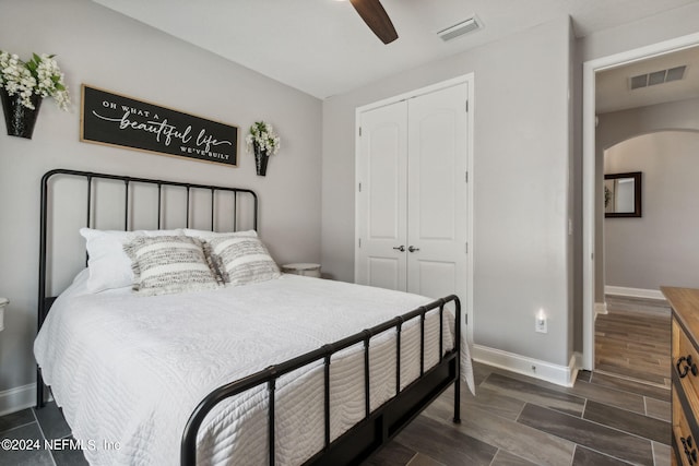 bedroom with ceiling fan and a closet