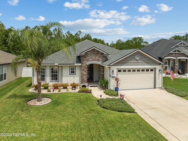 ranch-style home with a garage and a front yard