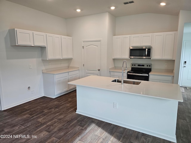 kitchen with stainless steel appliances, dark wood-type flooring, sink, a center island with sink, and white cabinets