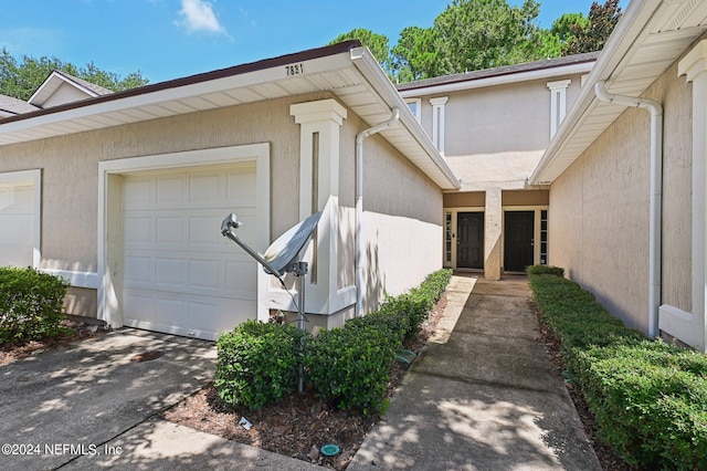 property entrance with a garage