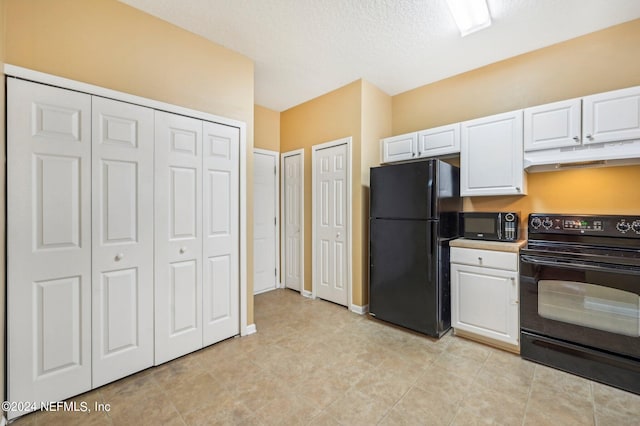 kitchen featuring white cabinetry, a textured ceiling, black appliances, and light tile patterned floors