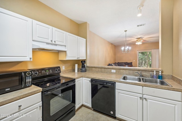 kitchen with white cabinetry, light tile patterned floors, black appliances, pendant lighting, and sink