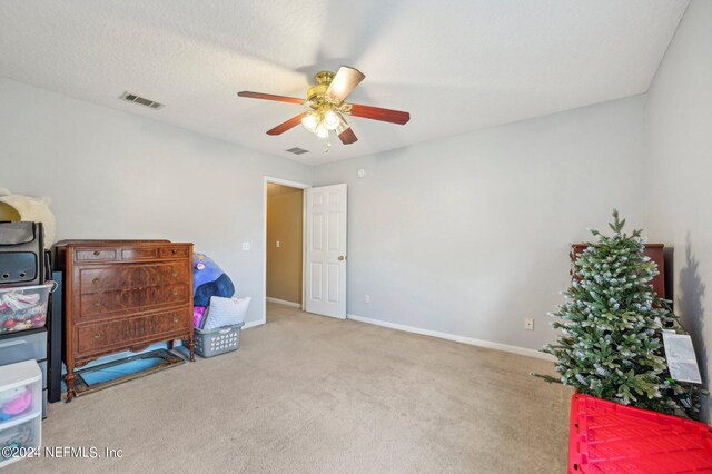 interior space featuring ceiling fan