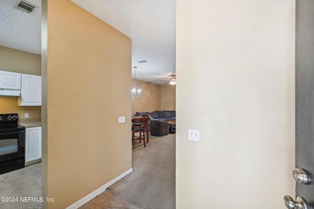 corridor with light colored carpet