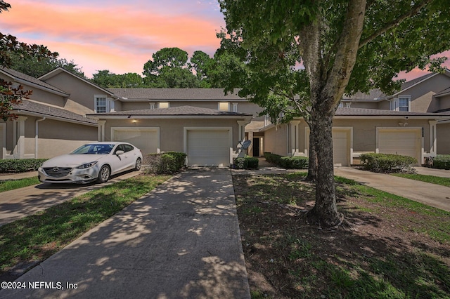 townhome / multi-family property featuring a garage