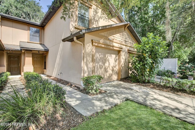 view of side of property featuring a garage