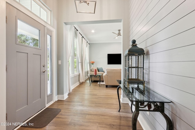 entryway featuring recessed lighting, baseboards, and wood finished floors