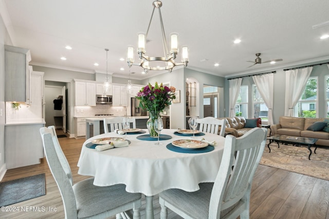 dining room with ornamental molding, recessed lighting, ceiling fan, and light wood finished floors