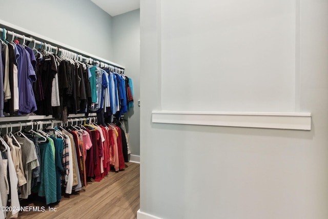 spacious closet with wood finished floors