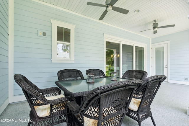 view of patio with a ceiling fan and outdoor dining space