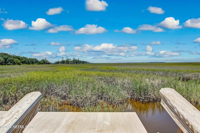 dock area featuring a water view and a rural view