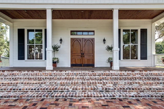 property entrance featuring covered porch