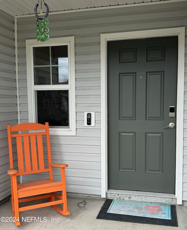 doorway to property with a porch