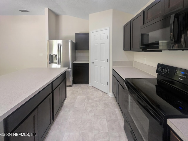 kitchen with black appliances, dark brown cabinetry, and a textured ceiling