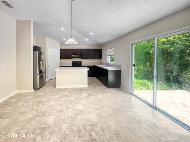 kitchen with dark brown cabinets, a textured ceiling, black appliances, decorative light fixtures, and a kitchen island